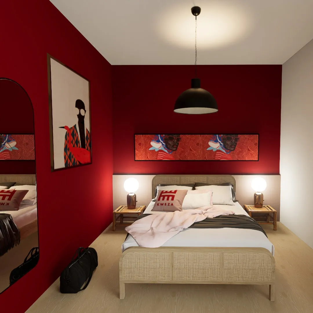 Bed against a deep red wall with portrait artwork and rattan headboard